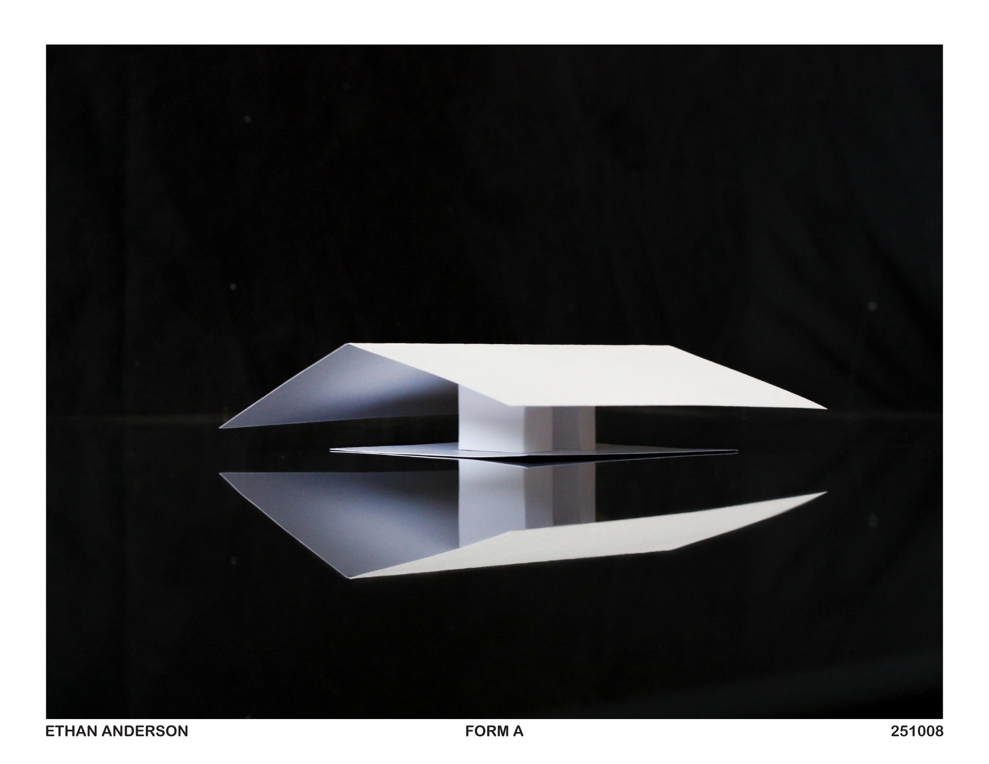 A white paper model on a black ground: a shallow, wide gable roof that slopes down to both sides, lifted on a single slim white support, its underside mirrored in the glossy surface below.
